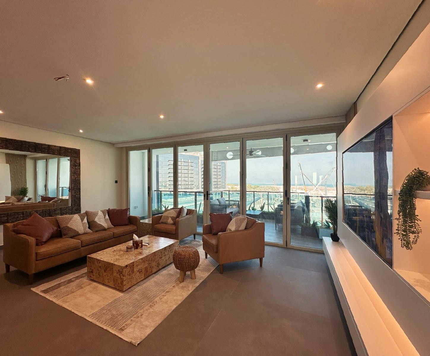 Completed furnished living room overlooking the lagoon at a Mina Al Arab duplex
